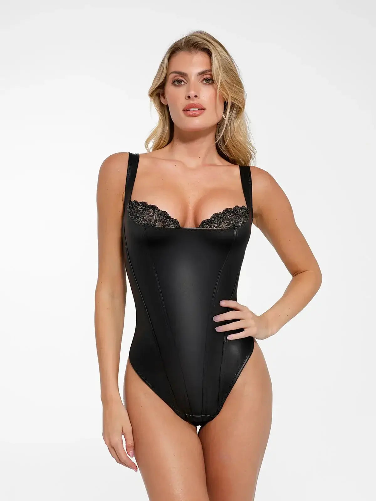 Shapewear balconette bodysuit made of faux leather with lace detailing, featuring adjustable straps and a flattering fit.