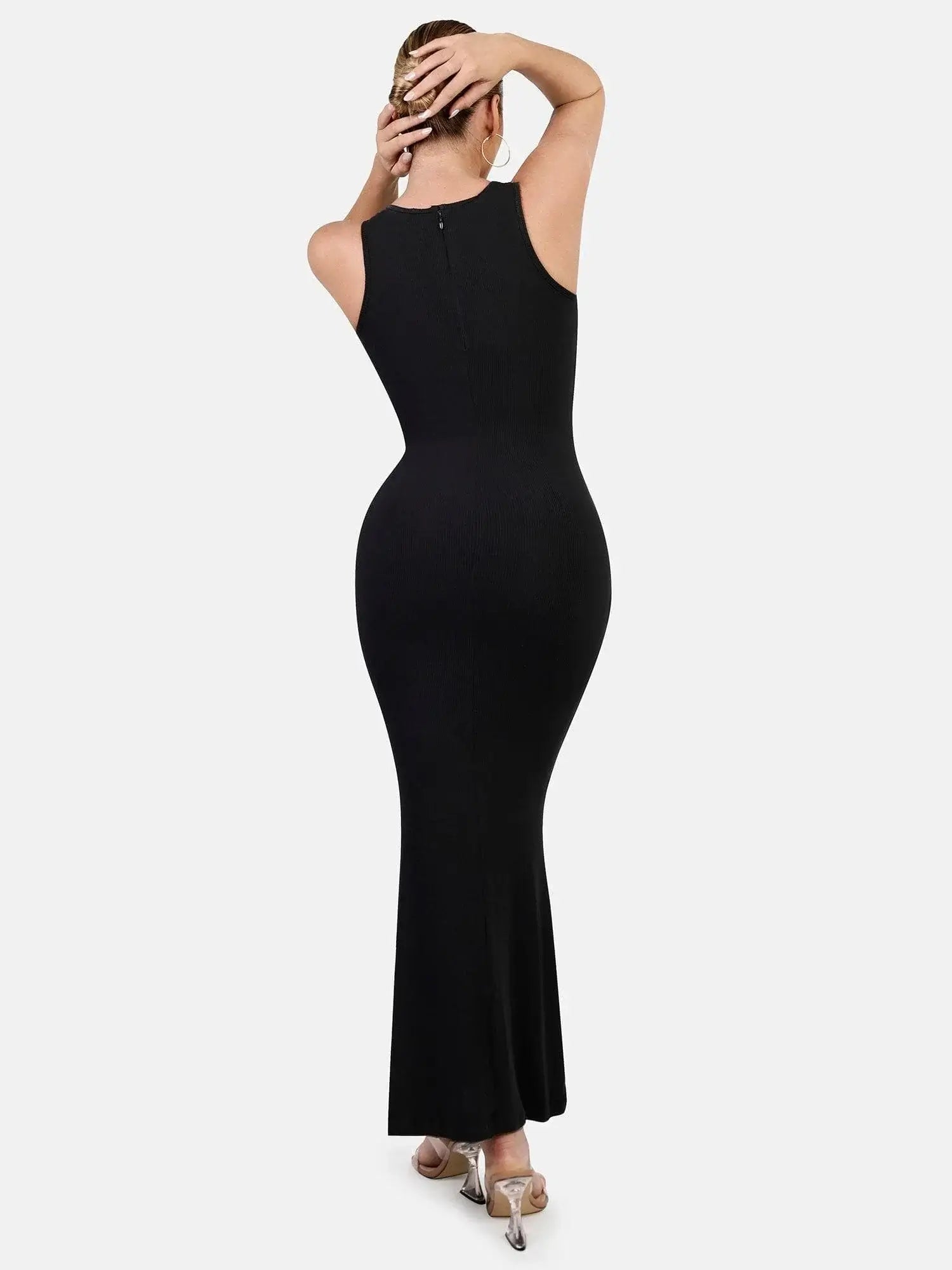 Shapewear maxikleid in black, showcasing a sleek back design and elegant silhouette on a model.